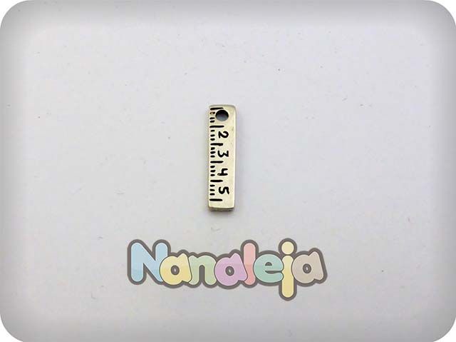 Charm regla zamak 20X5mm
