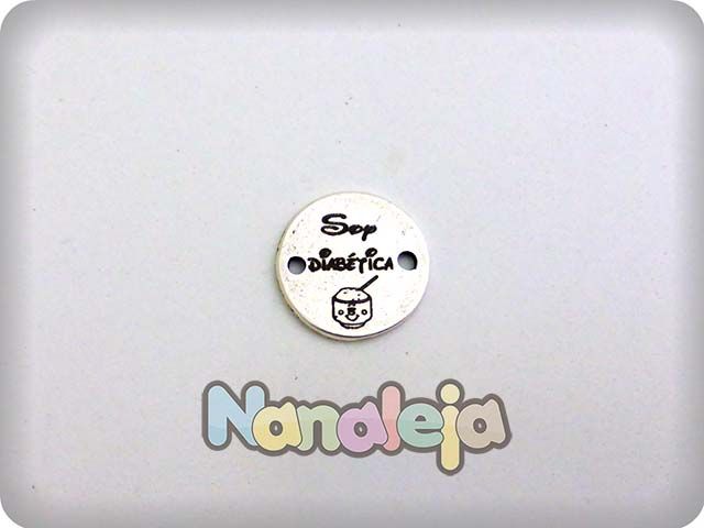 Grabado laser en medalla 22mm con dibujo dos agujeros de zamak 2 Grabado laser en medalla 22mm con dibujo dos agujeros de zamak