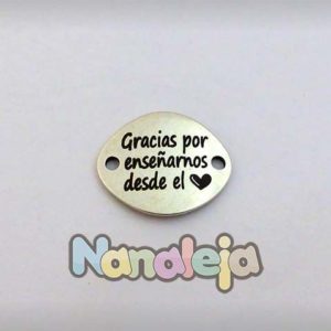 Grabado laser en placa ovalada alta 29X24mm de zamak (Editado con símbolo)